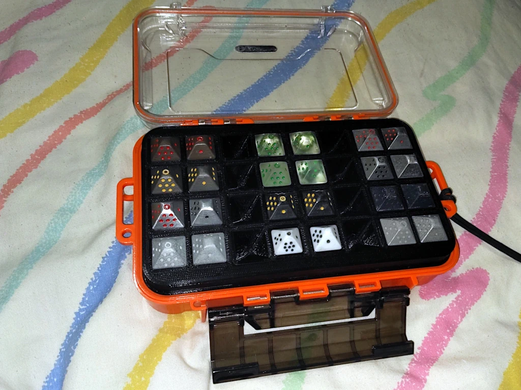 Tactix case open with dice-tray in place