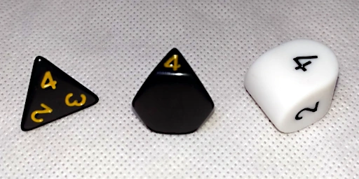 Three styles of 4-sided dice.