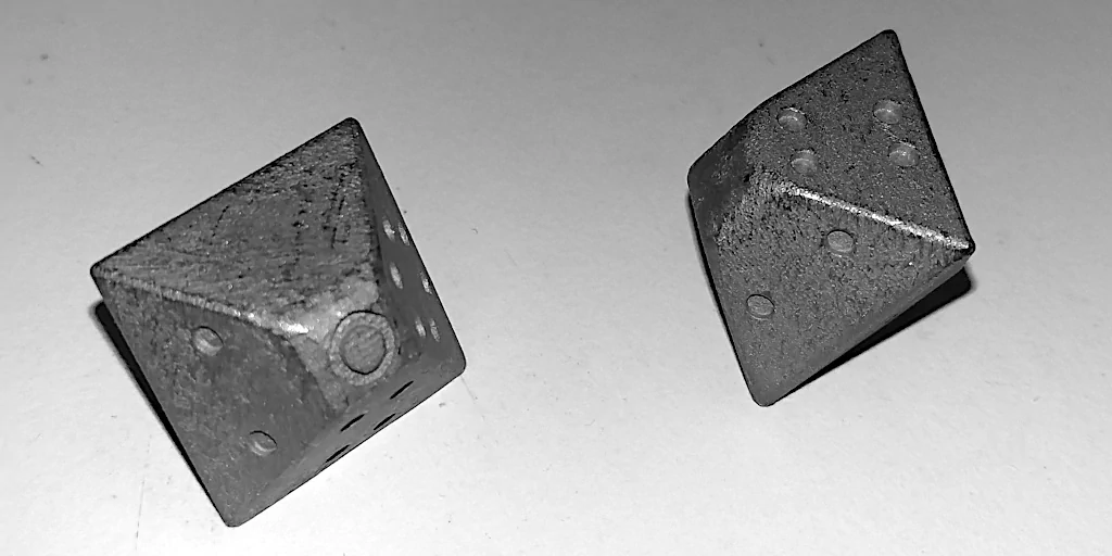 Rough-printed dice as they arrived in the post.